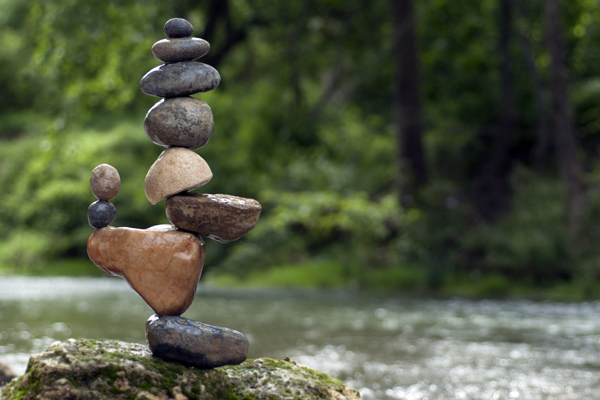  A meticulously balanced cairn of stones by a river